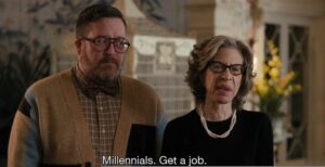 Frame da una serie TV con un uomo e una donna non giovani la donna dice: "Millennials. Get a job".